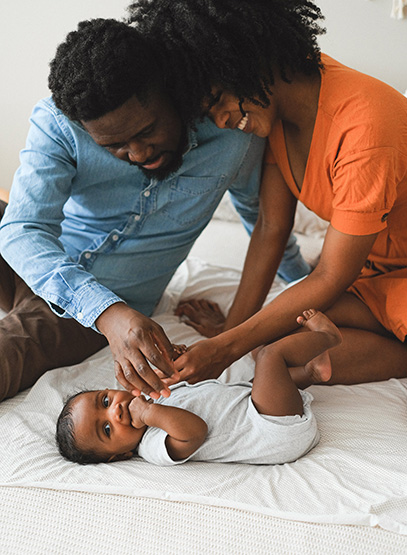 How to Get Pregnant. Afro-American couple with their baby boy.